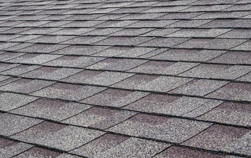 Row tiles for shallow pitch roofing